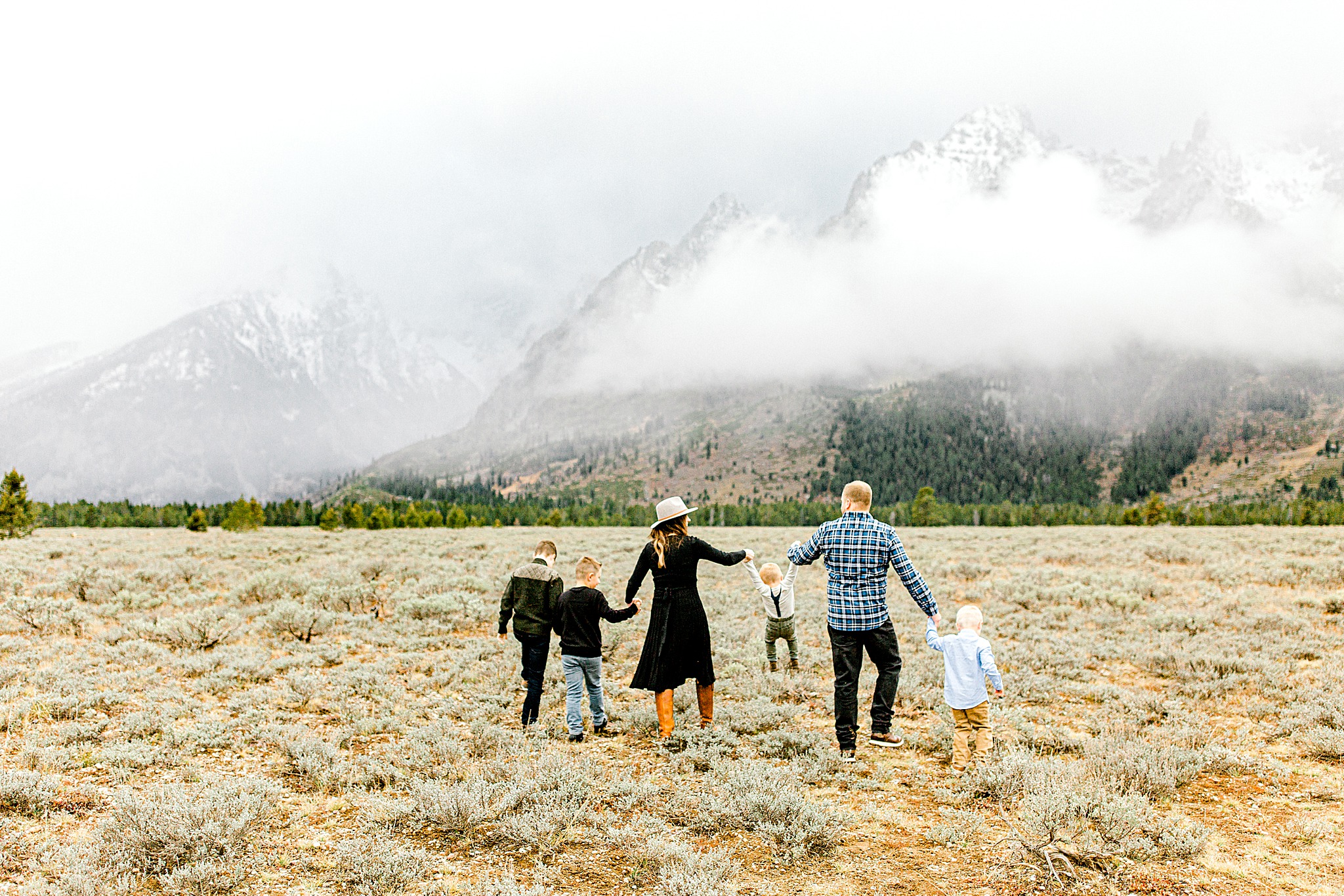 Family walking toward the Tetons